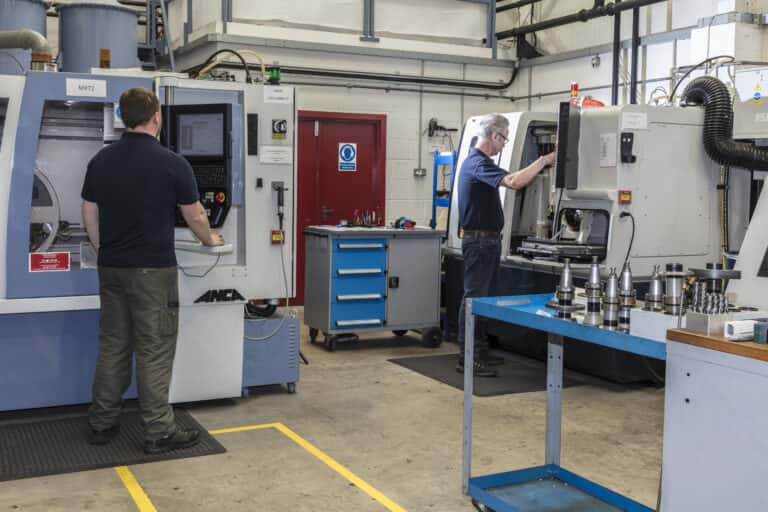 People working in machine shop